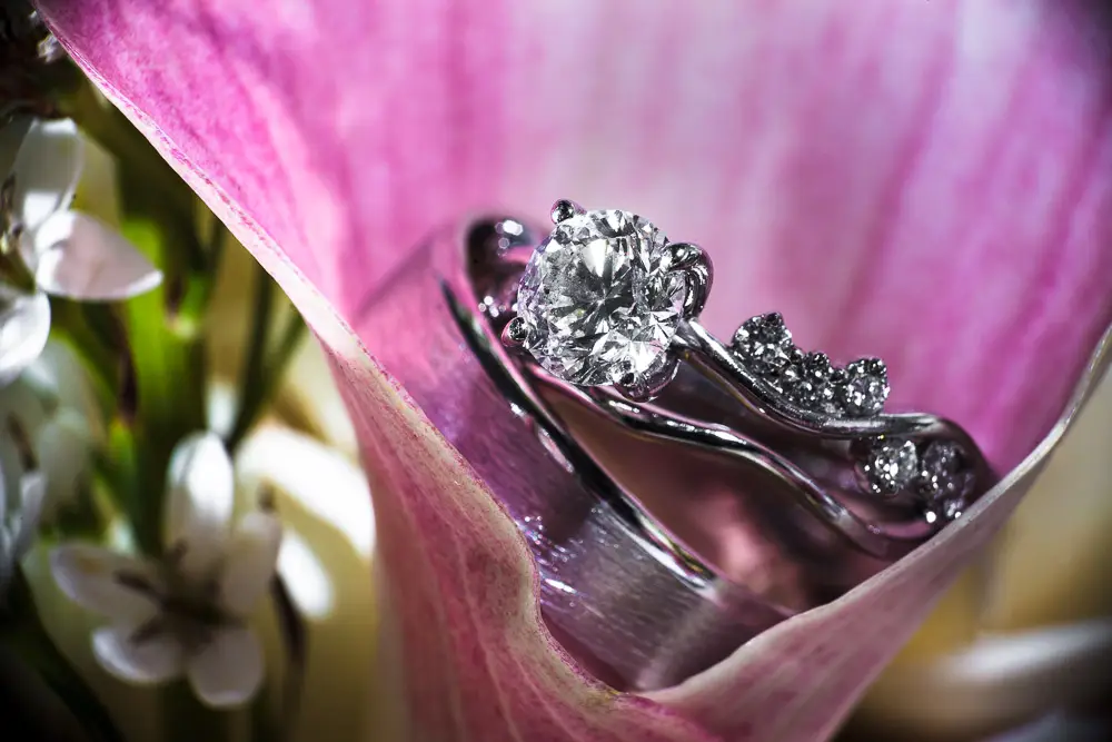 Elegant wedding ring and bouquet detail from a romantic Virginia ceremony.