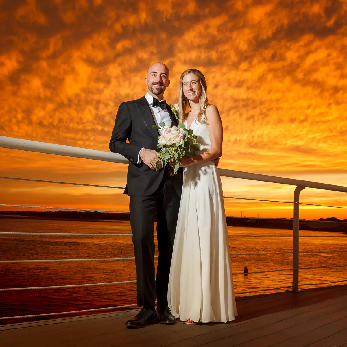 Bride and groom wedding portrait at Lesner Inn in Virginia Beach by Virginia wedding photographer.
